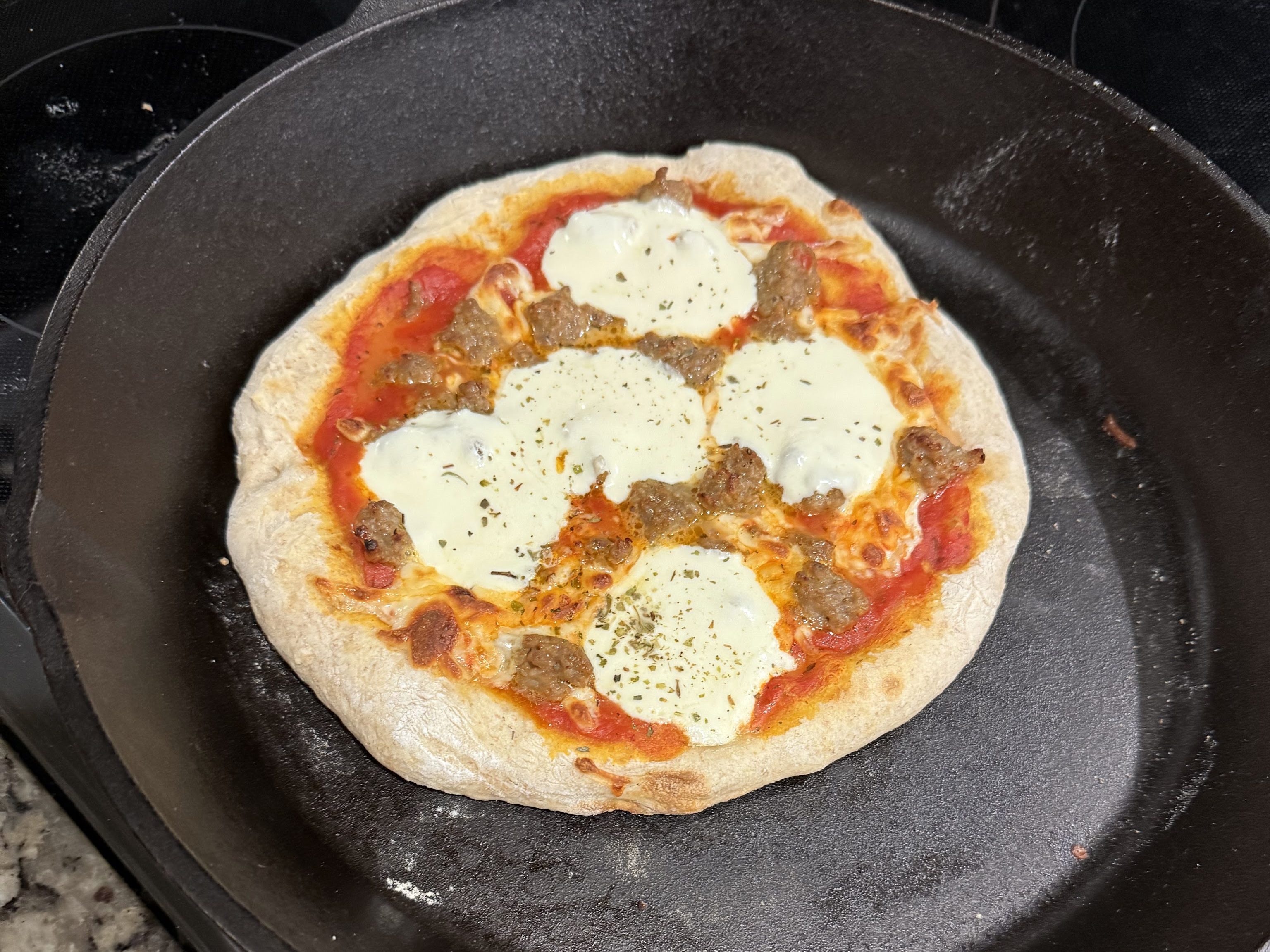 sourdough pizza cooked on cast iron